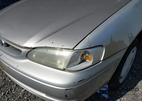 1999 Toyota Corolla Ce from USA, damaged, VIN 2T1BR12E1XC141396